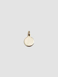 Gold pendant on a light gray background