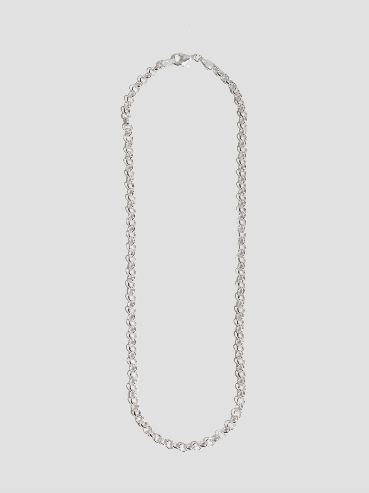 Sterling Silver Rolo Chain Necklace pictured on light grey background. 