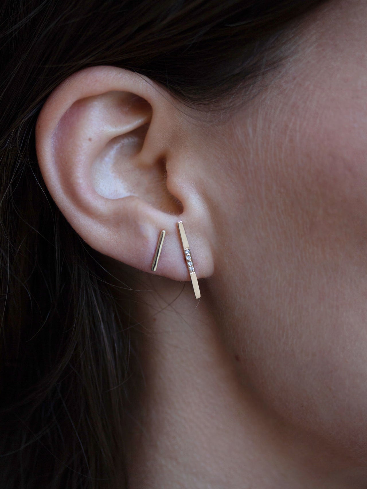 14kt Yellow Gold Diamond Rod Stud Earring pictured on model.