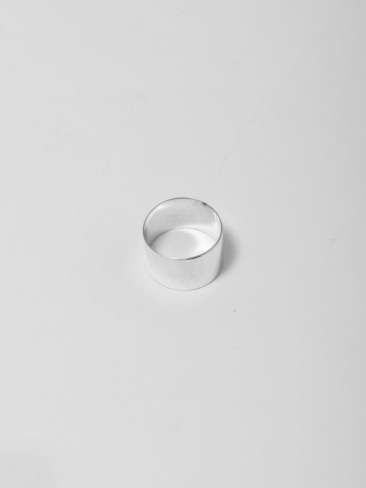 Sterling Silver XL Hug Band pictured from above. Light grey background. 
