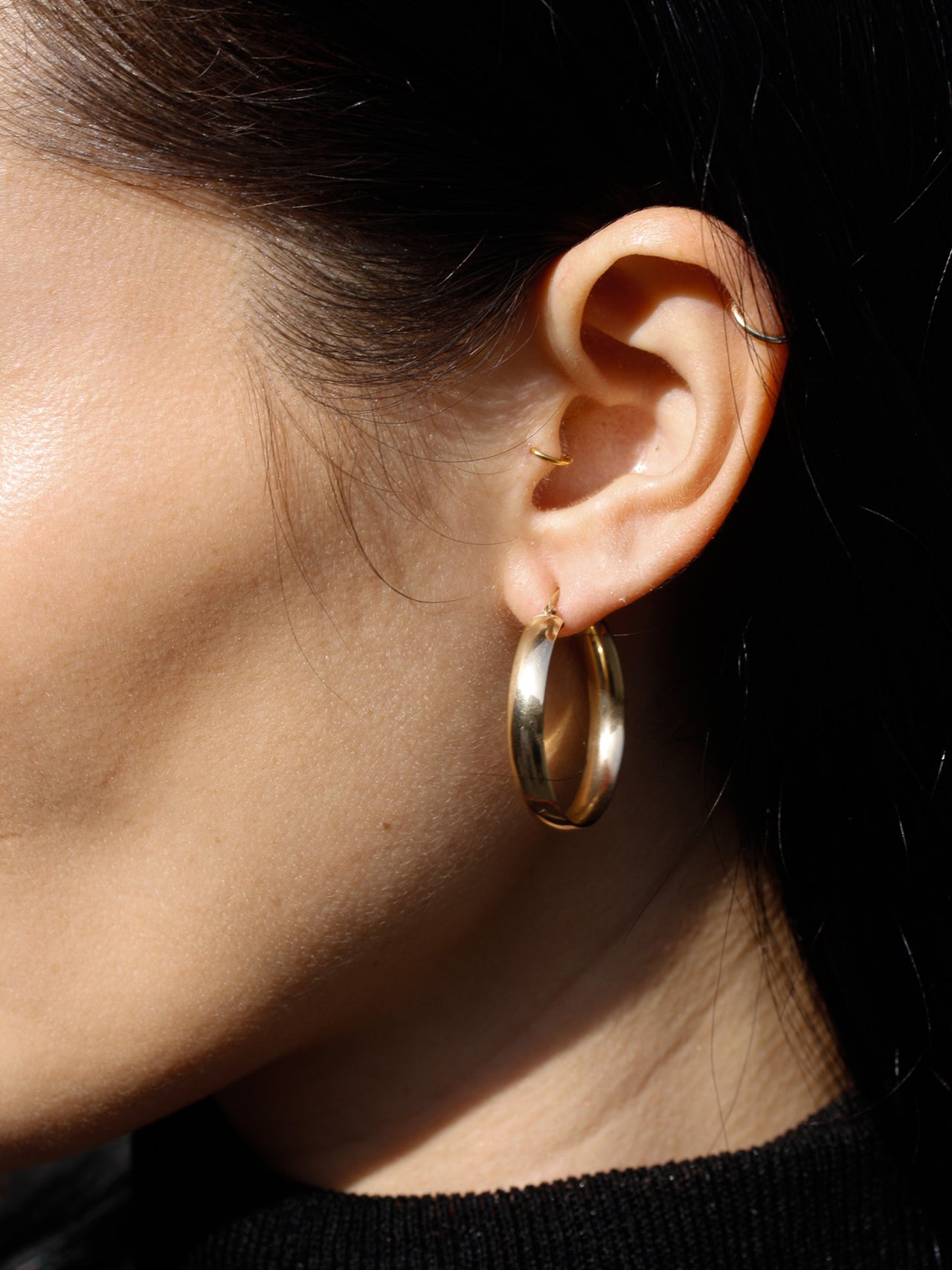 14kt Yellow Gold Legacy Hoops pictured on model.