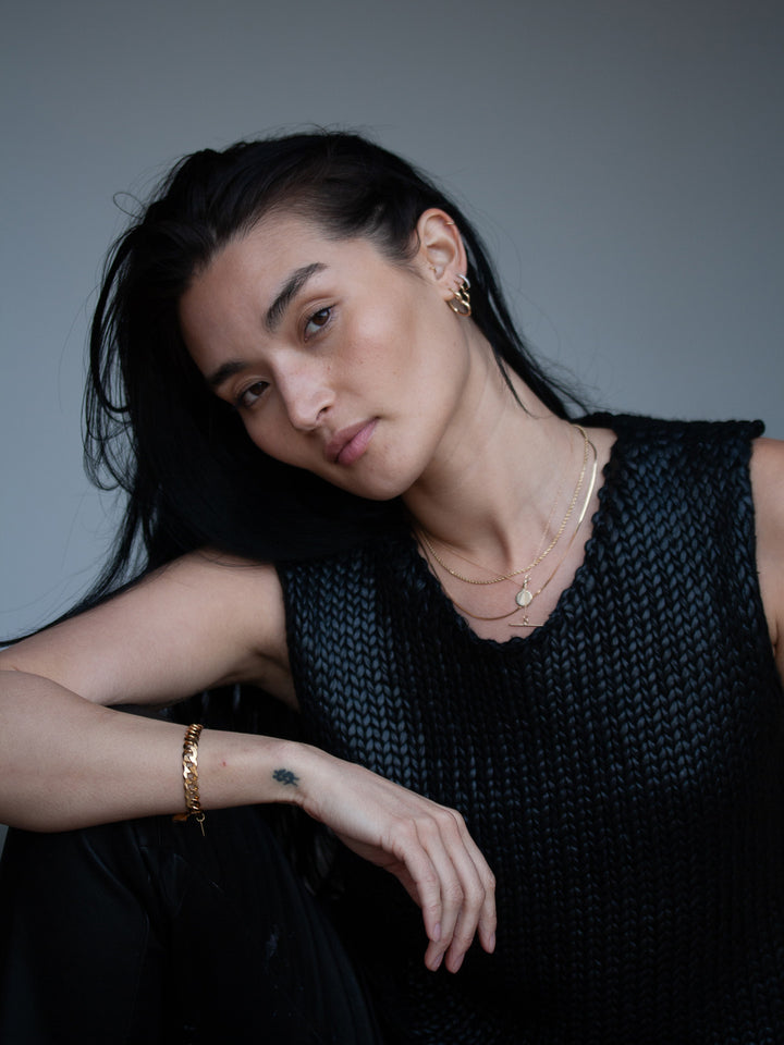 Vermeil Flat Curb Chain Bracelet pictured on models wrist. 