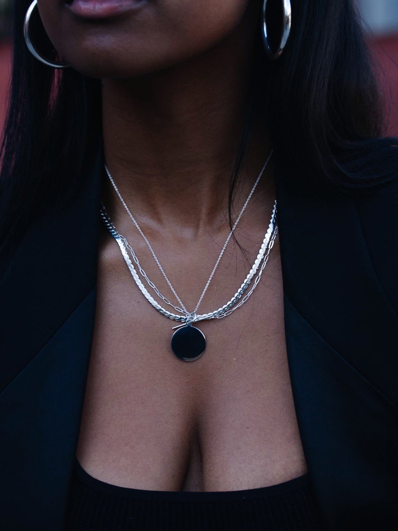 Sterling Silver Disk & Toggle Necklace pictured on model. Layered with other chains. 