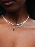 14kt Yellow Gold Rice Pearl Choker pictured on model. Layered with the Seed Pearl Safety Pin Choker. 