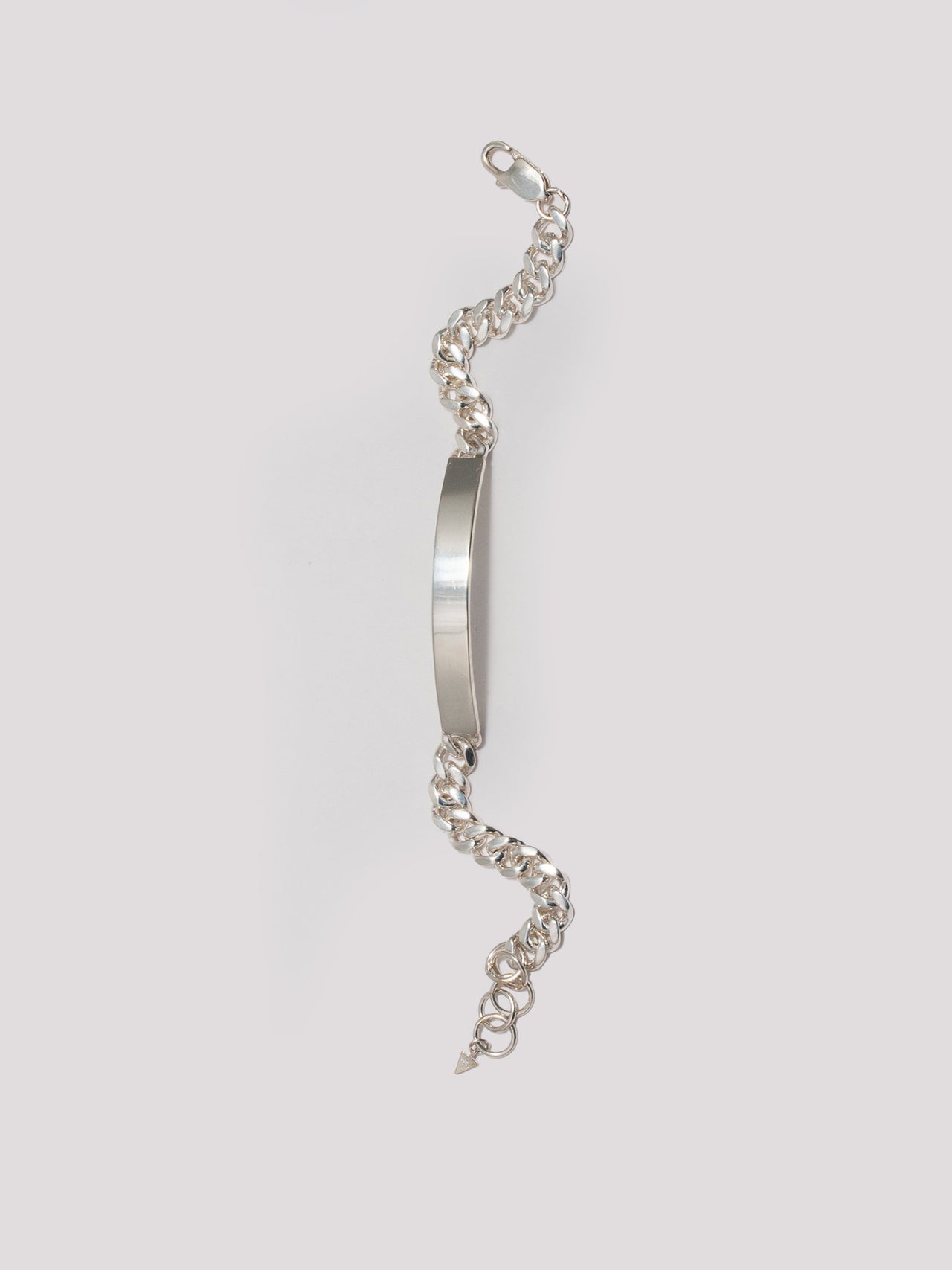 Sterling Silver Industrial ID Bracelet pictured unclasped horizontally laid out on light grey background.