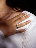 Eternity Dome Band pictured on models hand. 