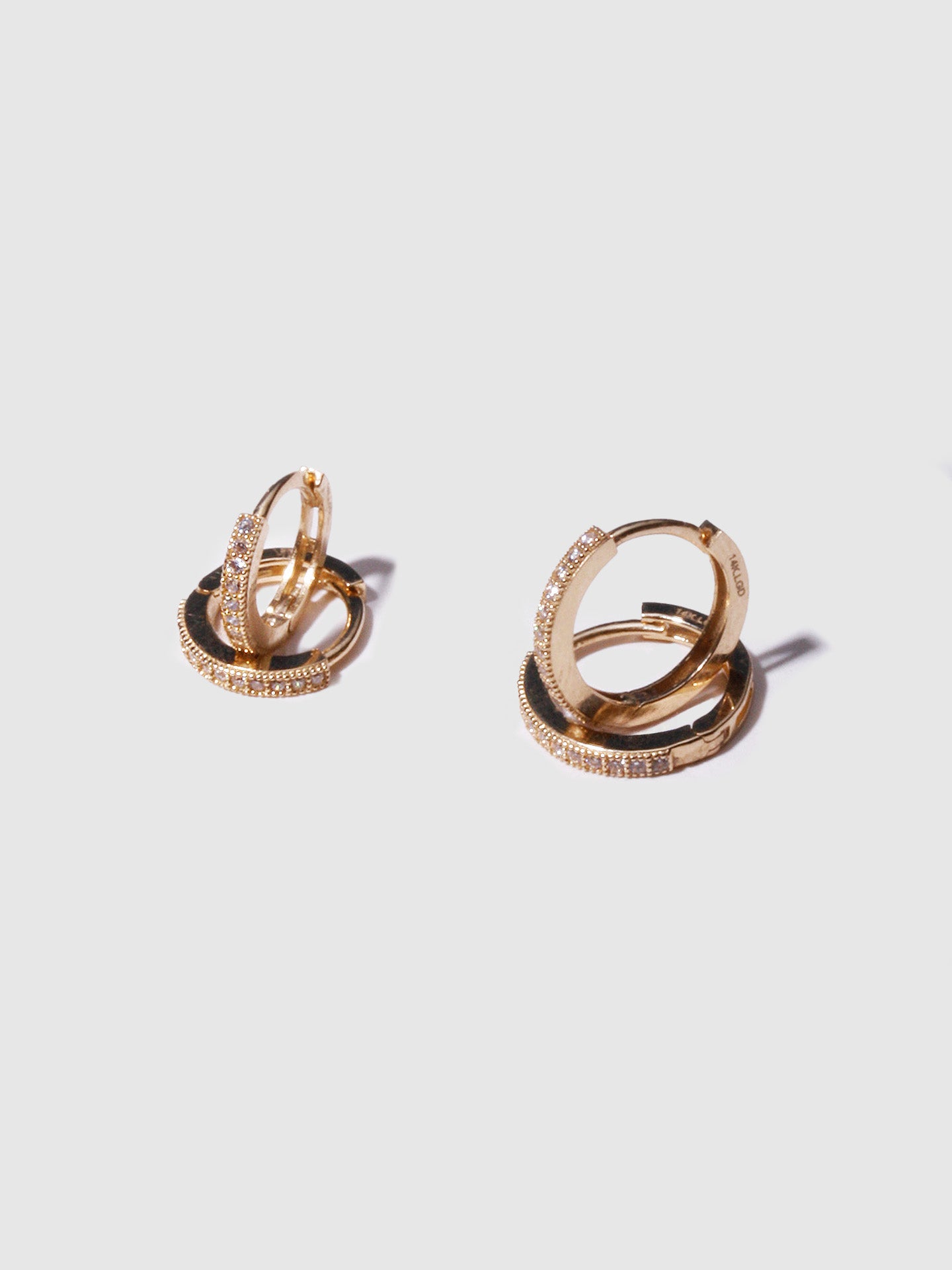 14kt Yellow Gold Baby Pave Hoops pictured along side the Pave Hoops.