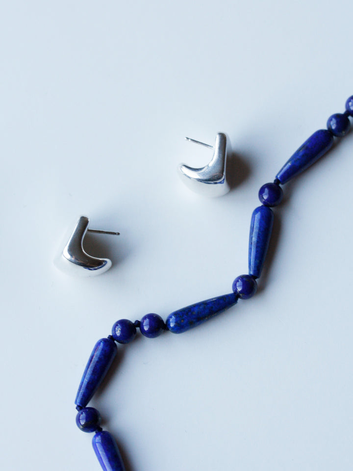 Sterling Silver Hot Box Huggies pictured along side the Cote d' Azur Bracelet.