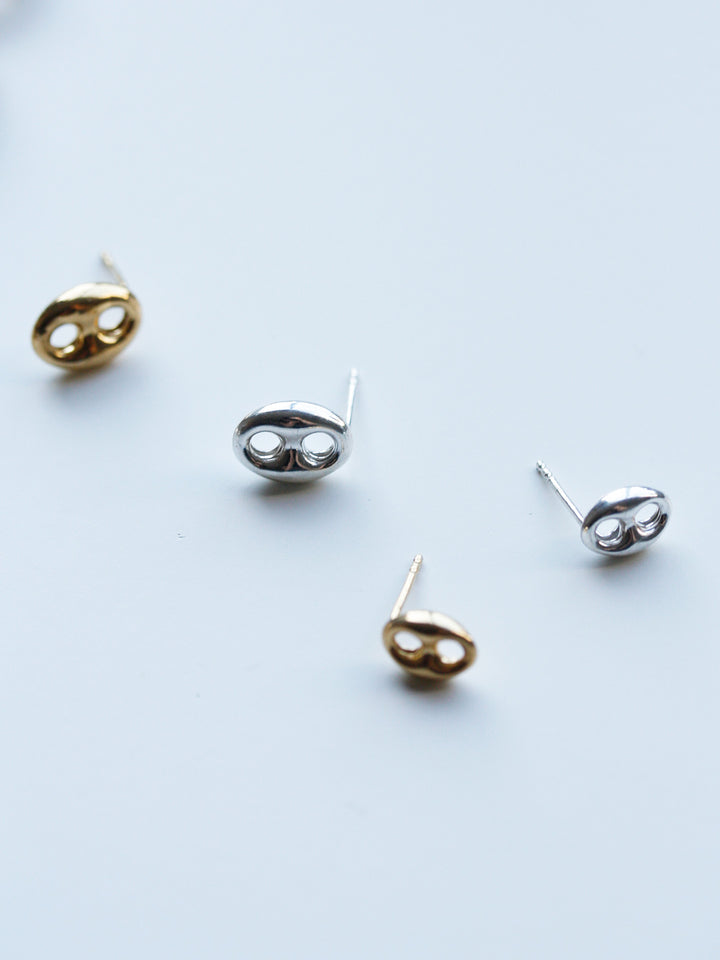 Flat lay of Sterling Silver Mini Nautica Studs with the Vermeil version. 