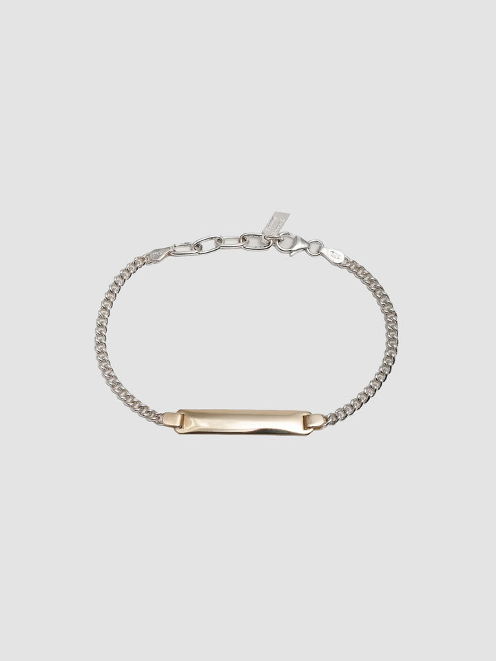 Mini Watts ID Necklace pictured on light grey background.