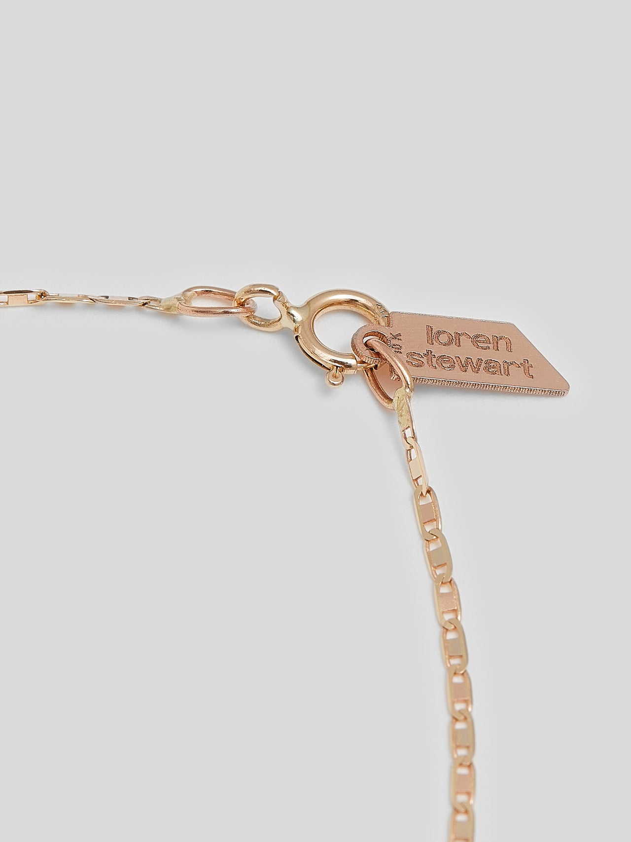 Product image of 10kt yellow gold thin chain necklace on white background.