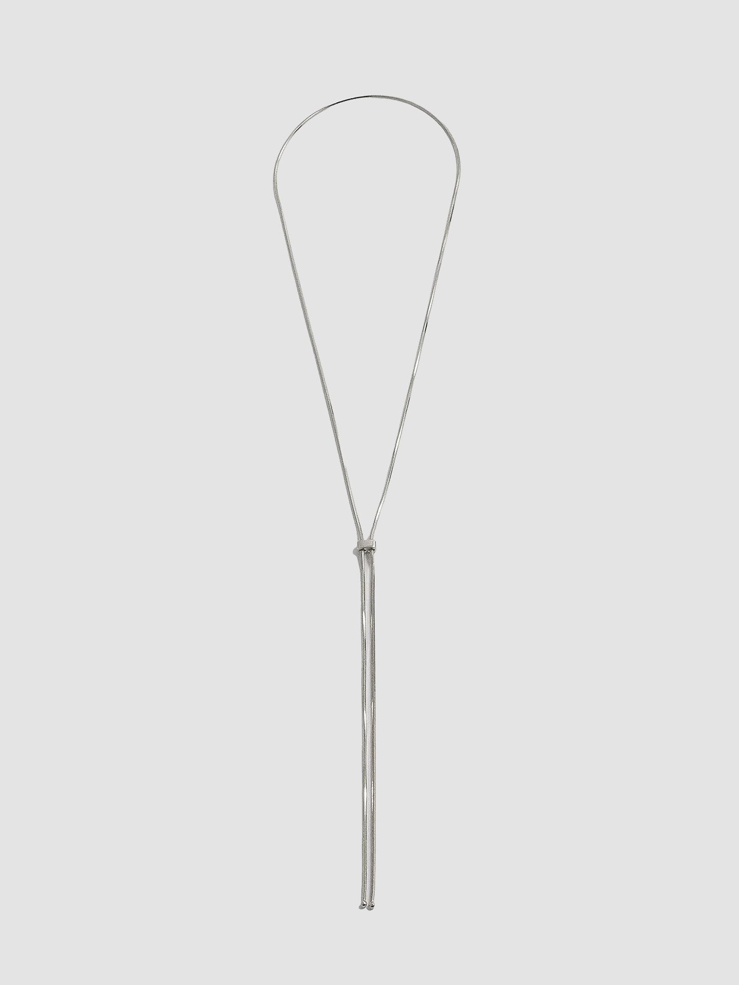 Bolo Pendant Necklace pictured on light grey background.