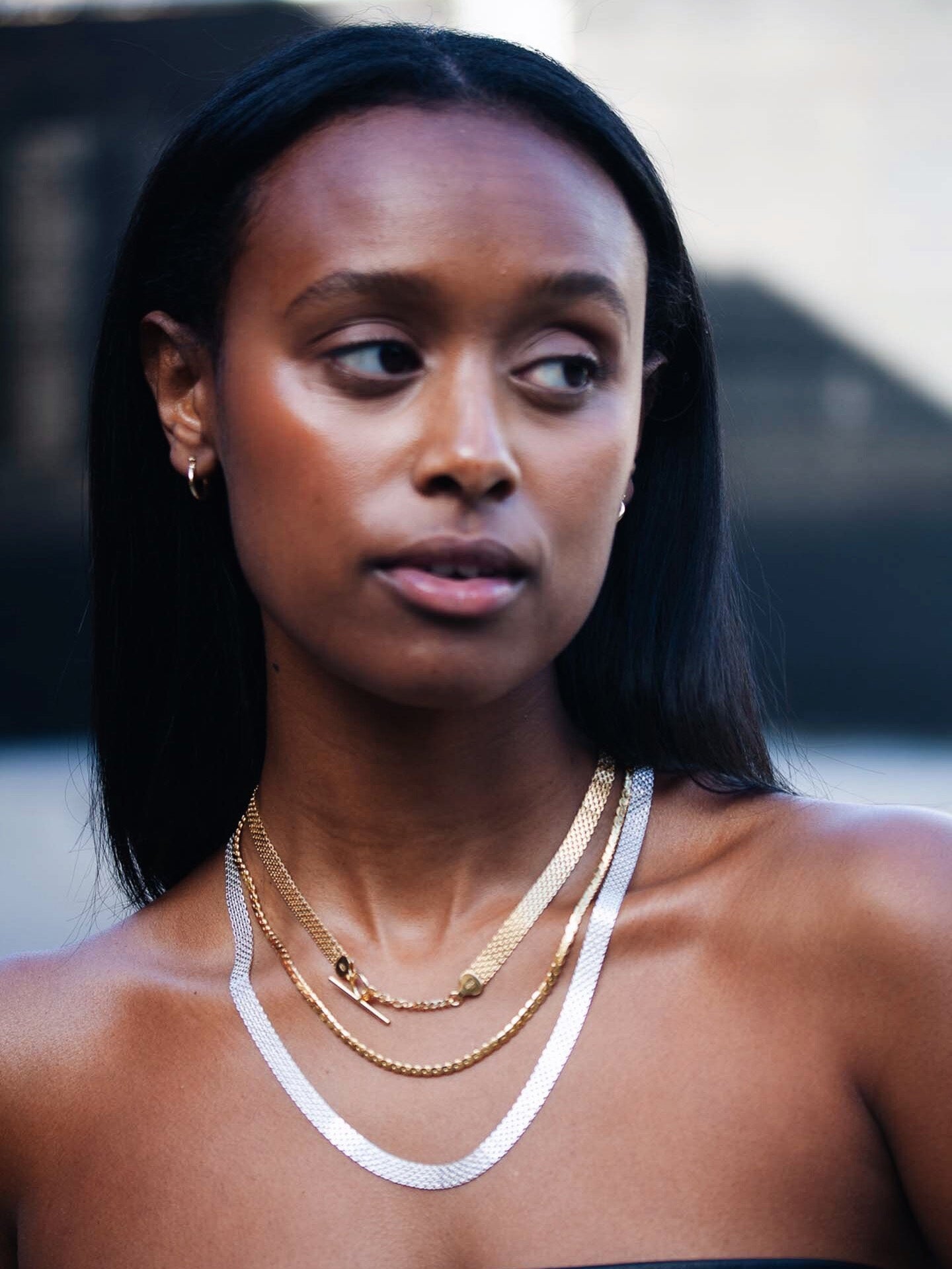 Vermeil Serpentine Chain Necklace pictured on model. Layered with other necklaces.