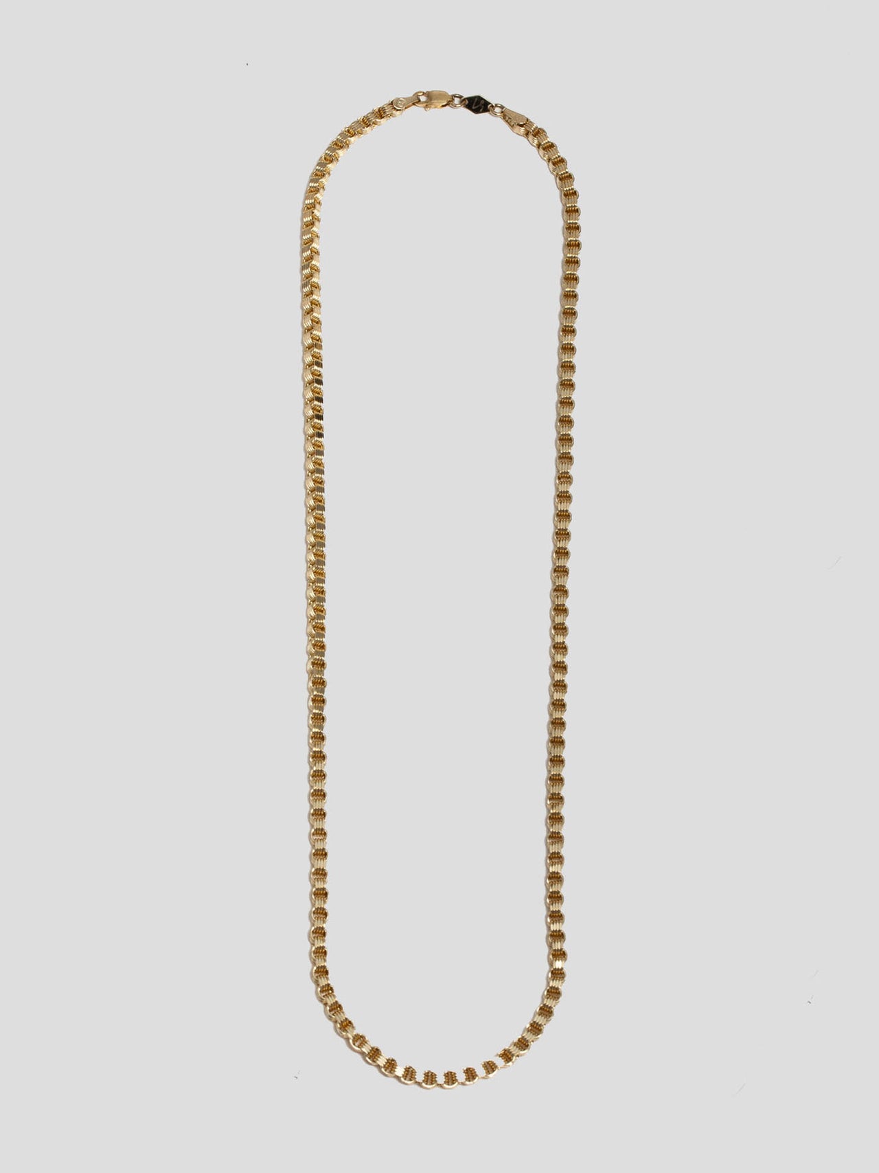 10kt Yellow Gold Alexander Chain pictured on light grey background.  Edit alt text