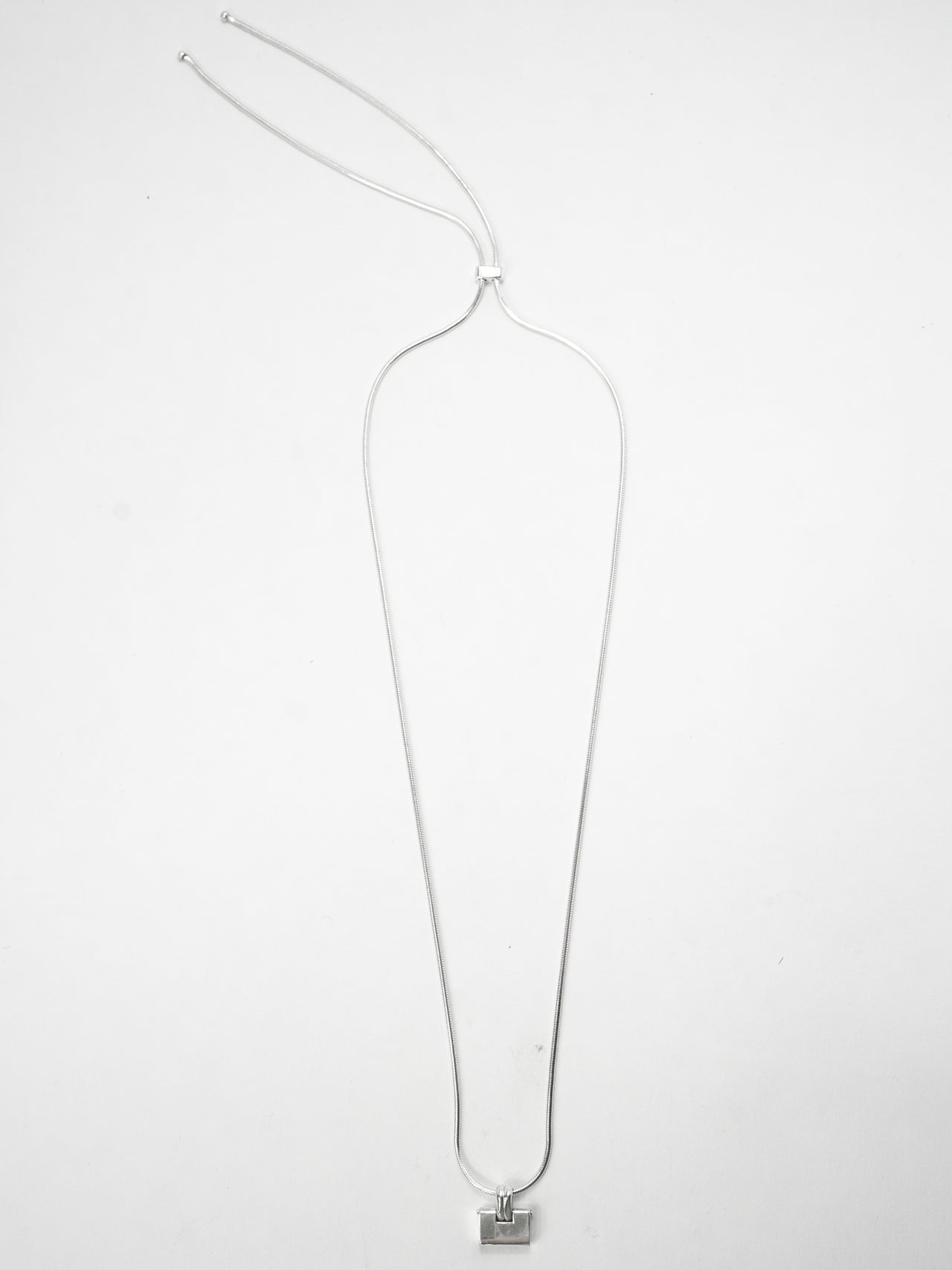 Sterling Silver Padlock Bolo Chain Necklace pictured on light grey background.