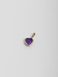 14kt Yellow Gold Amethyst Gemstone Heart Charm pictured on light grey background. 