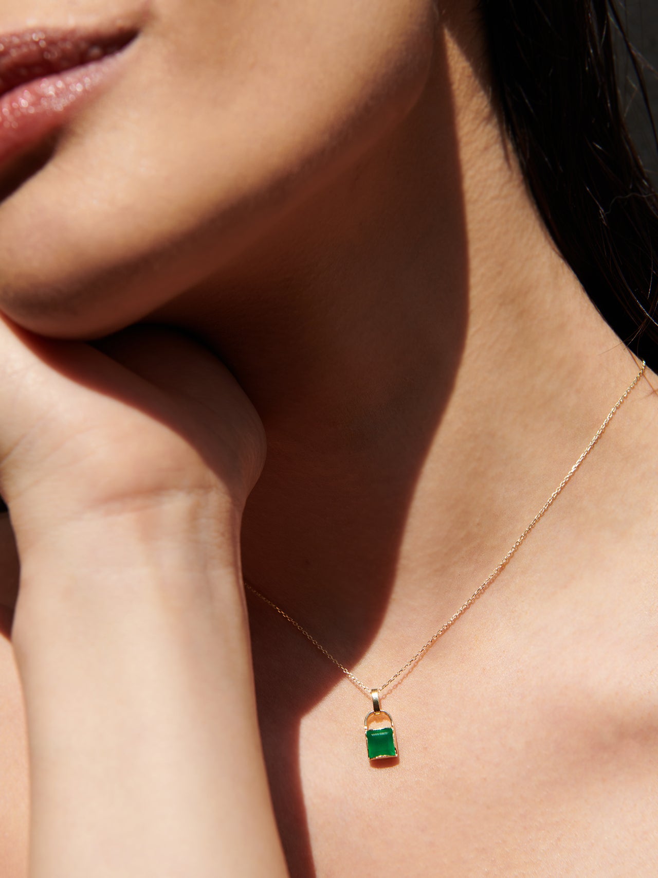 14kt Yellow Gold Green Onyx Padlock Pendant pictured on model.