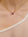 14kt Yellow Gold Amethyst Gemstone Heart Charm pictured on gold chain along with the Pink Tourmaline Padlock Pendant. 
