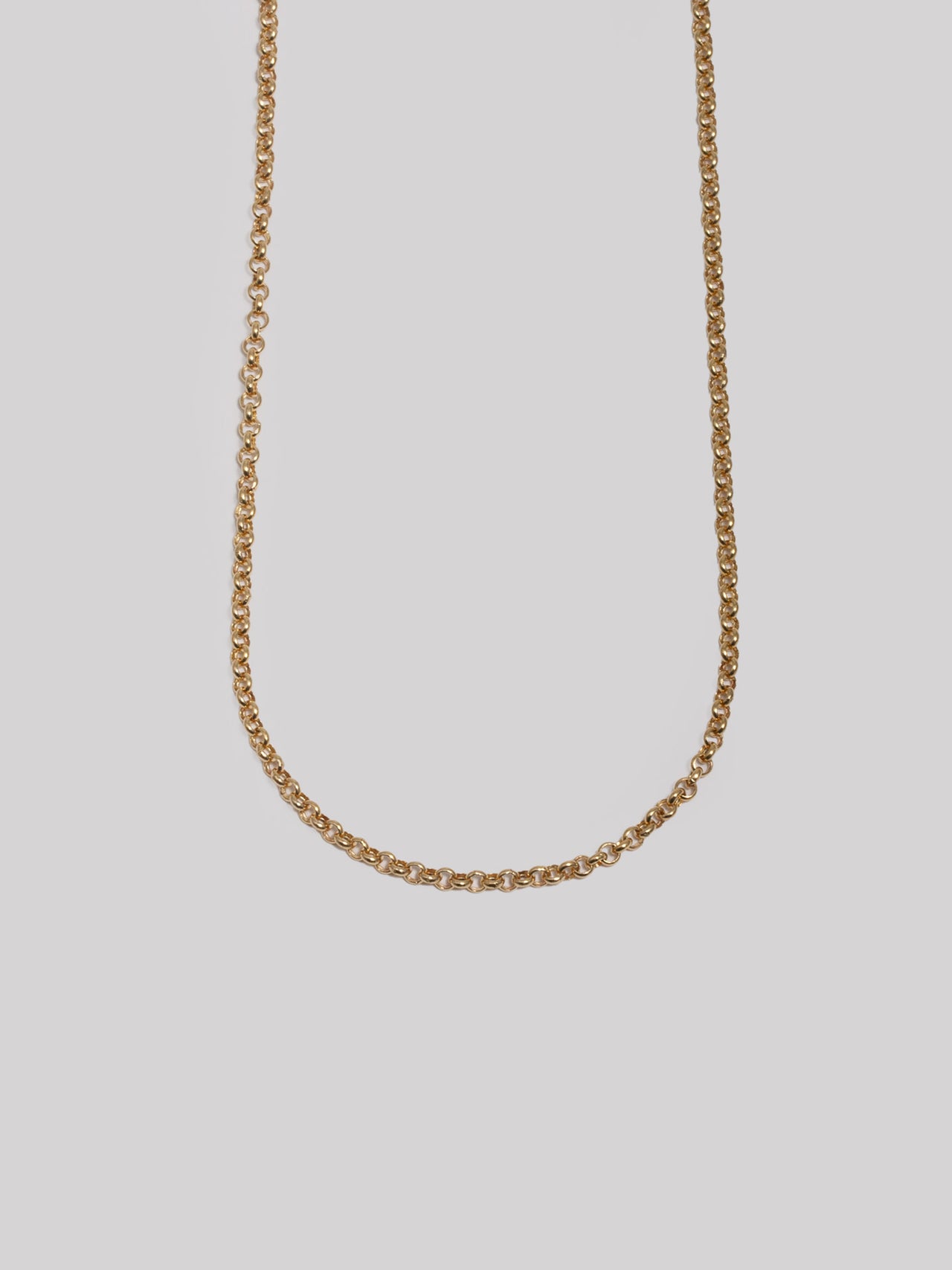 Half shot of 14kt Yellow Gold Hollow Rolo Chain Necklace. Light grey background. 