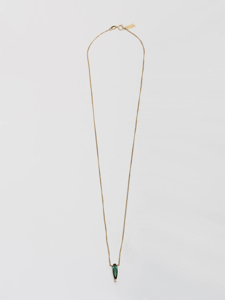 14kt Yellow Gold Tourmaline Shard Necklace pictured on light grey background. 
