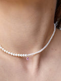 14kt Yellow Gold Pearl Necklace pictured on models neck.