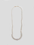 14kt Yellow Gold Graduating Pearl Necklace with hook closure pictured on light grey background. 