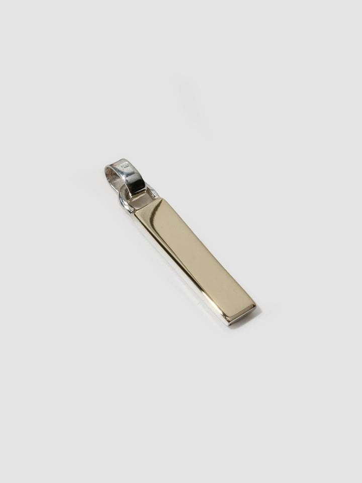 Mixed Metal Zipper Pendant pictured on light grey background.