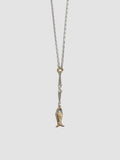 Necklace with a fish-shaped pendant on a light gray background
