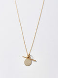 14Kt Yellow Gold Disk and Toggle Necklace pictured on light grey background.