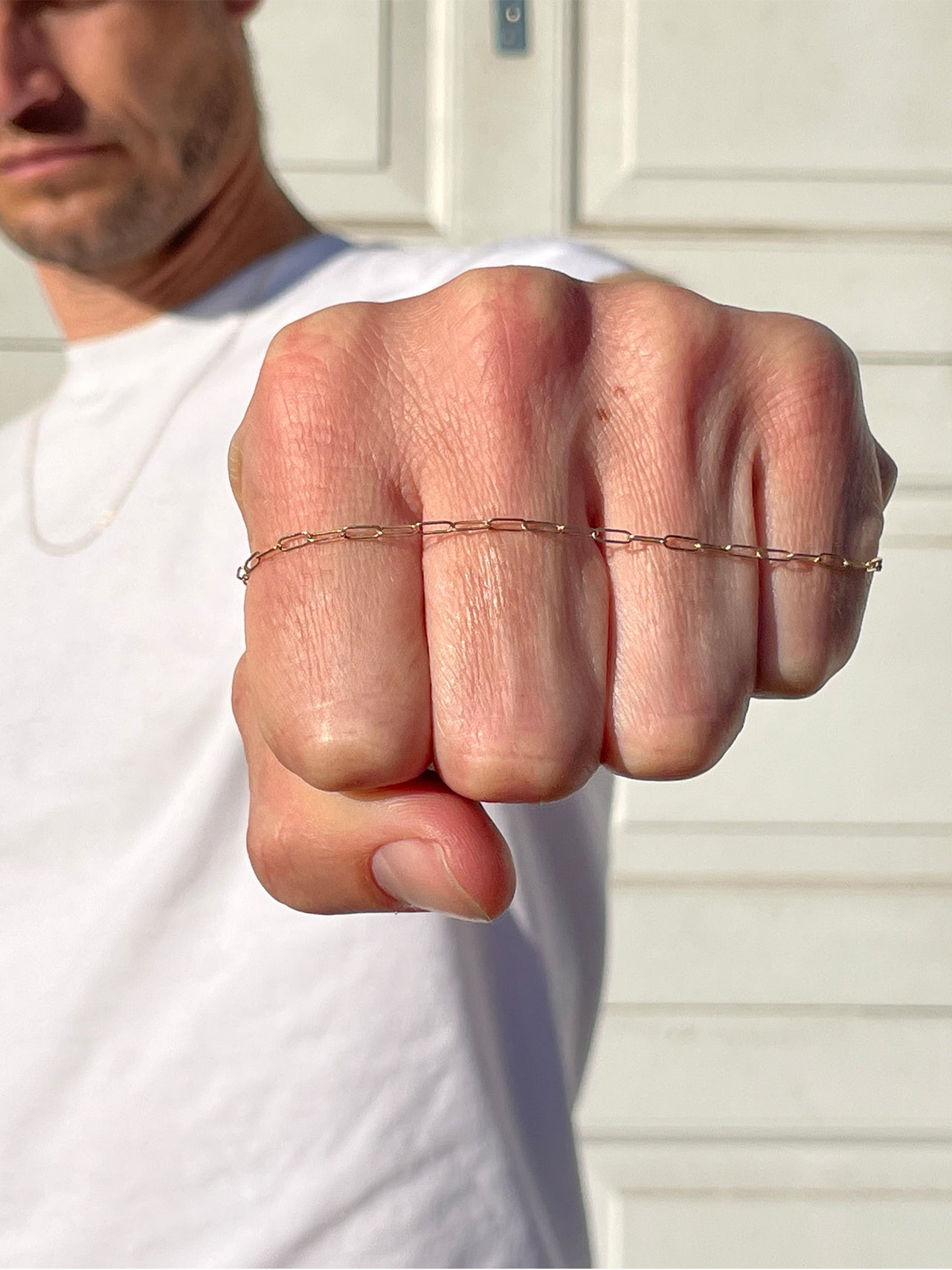 14Kt Yellow Gold Lightweight Long Link Chain pictured on models fist. 