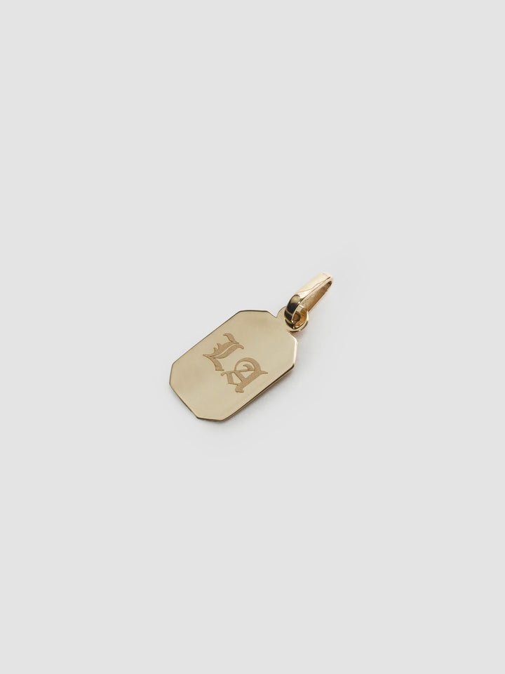 Octagonal ID Pendant pictured on light grey background.