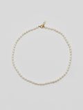14kt Yellow Gold Rice Pearl Choker pictured on light grey background