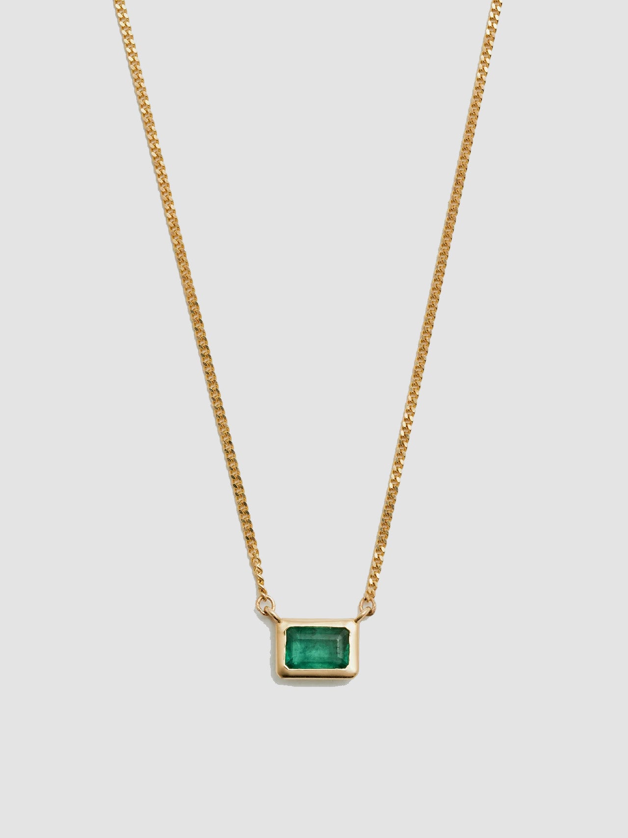 Close up of Emerald on Emerald Cut Bezel Necklace