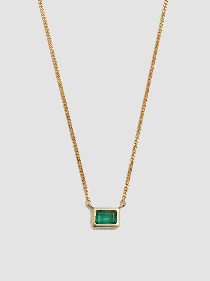 Close up of Emerald on Emerald Cut Bezel Necklace