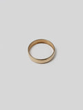 14Kt Yellow Gold Eternity Dome Ring pictured on light grey background.