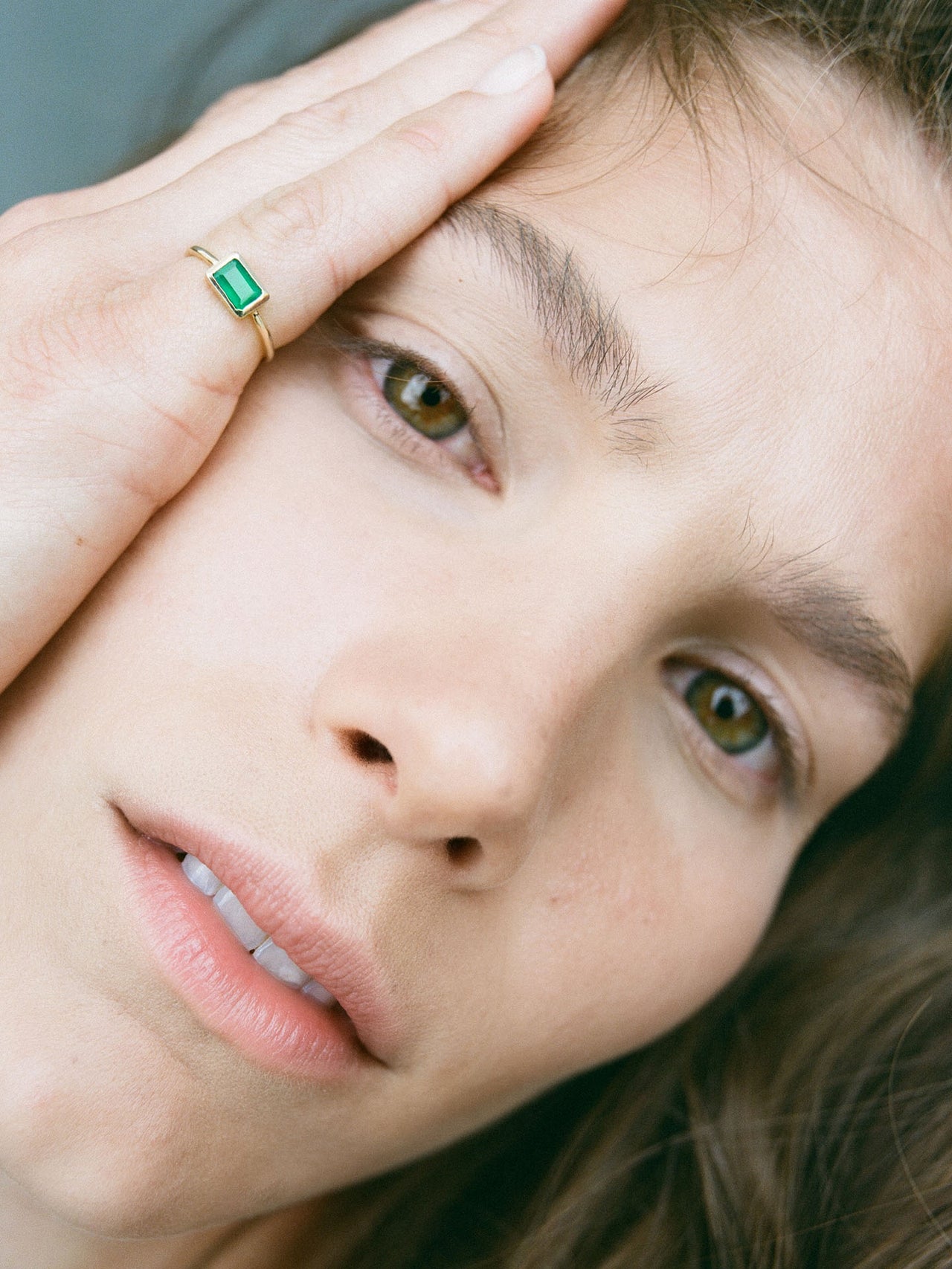 Emerald Cut Bezel Ring V.i pictured on models pinky finger.