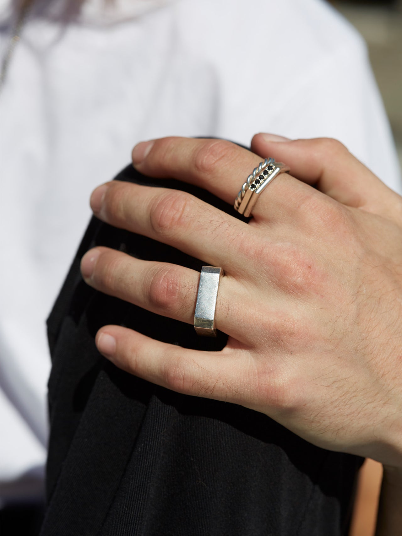 Sterling Silver Solid Bolt Ring pictured on models hand.