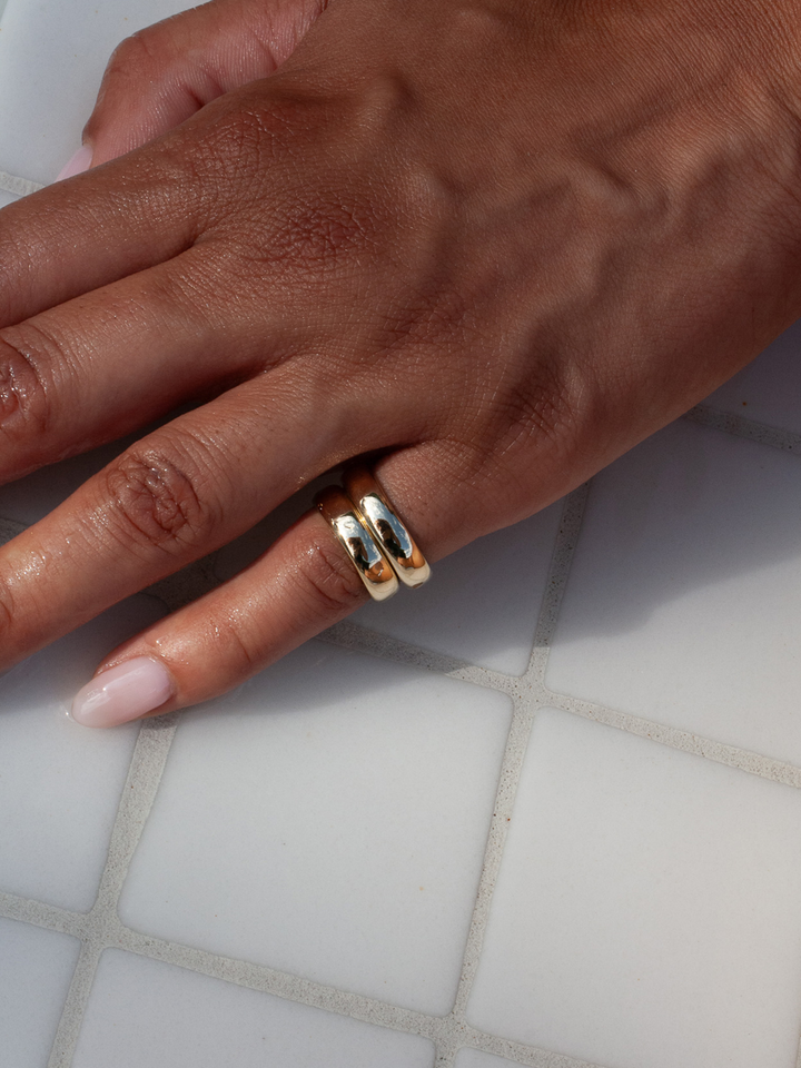 14kt Yellow Gold Dome Band pictured on models pinky finger. 