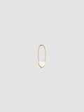 A single gold heart safety pin earring on a white background