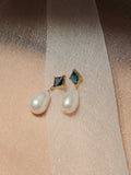 14kt Yellow Gold Gem Baroque Link Earrings pictured on silk fabric against skin. 