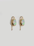 Opal French Wire Hook Earrings pictured on white background.