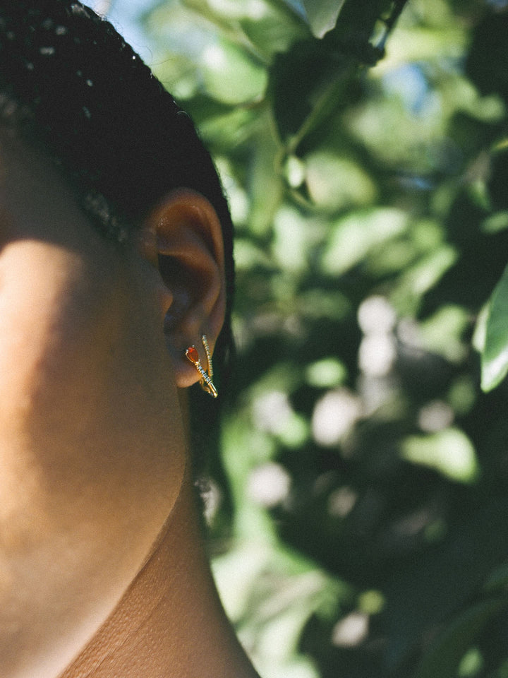 14kt Yellow Gold Mini Diamond Fire Opal Safety Pin pictured on model. 