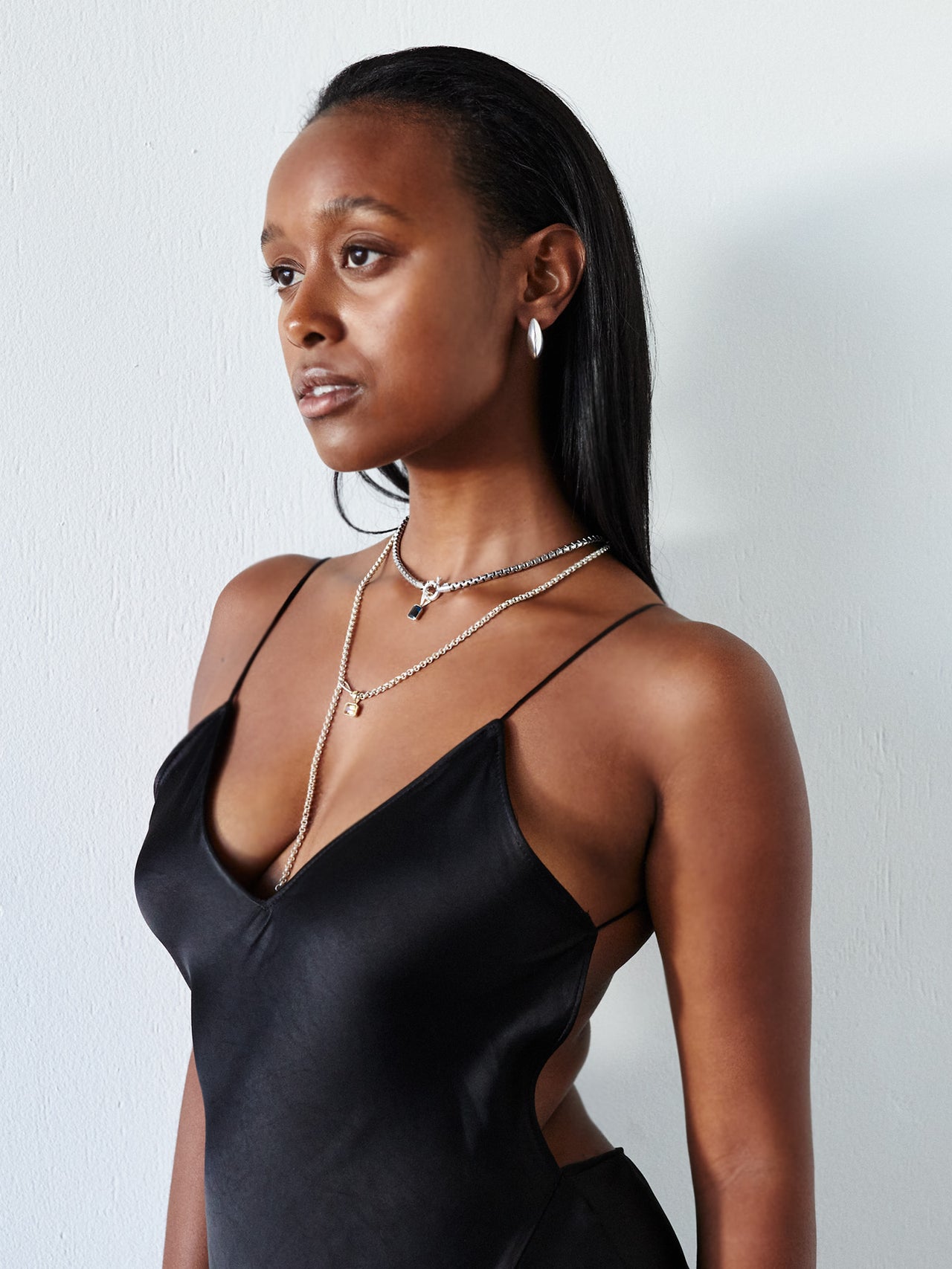 Sterling Silver Hollow XL Hammock Hoops pictured on model. Styled look. 