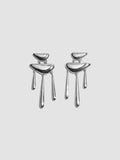 Pair of silver earrings on a light gray background