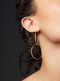 Close up of 14Kt Yellow Gold Ultralight Infinity Hoops pictured on model. Two hoops connected.