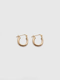 14Kt Yellow Gold Mini Tube Hoop Earrings pictured on light grey background.