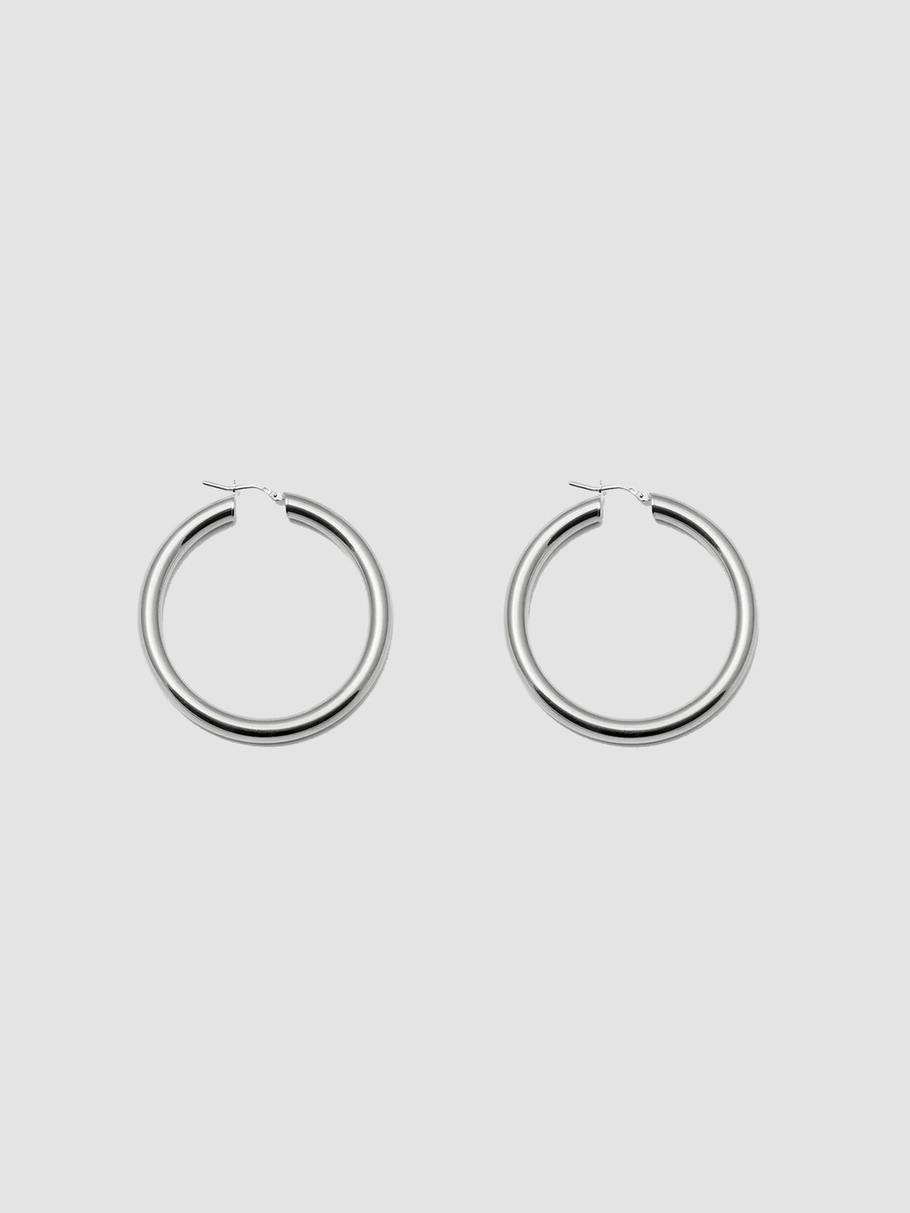 Product shot of the Tru Hoops in Sterling Silver (Sterling Silver Hoops 49.5mm diameter  5mm thick) Background: Grey backdrop