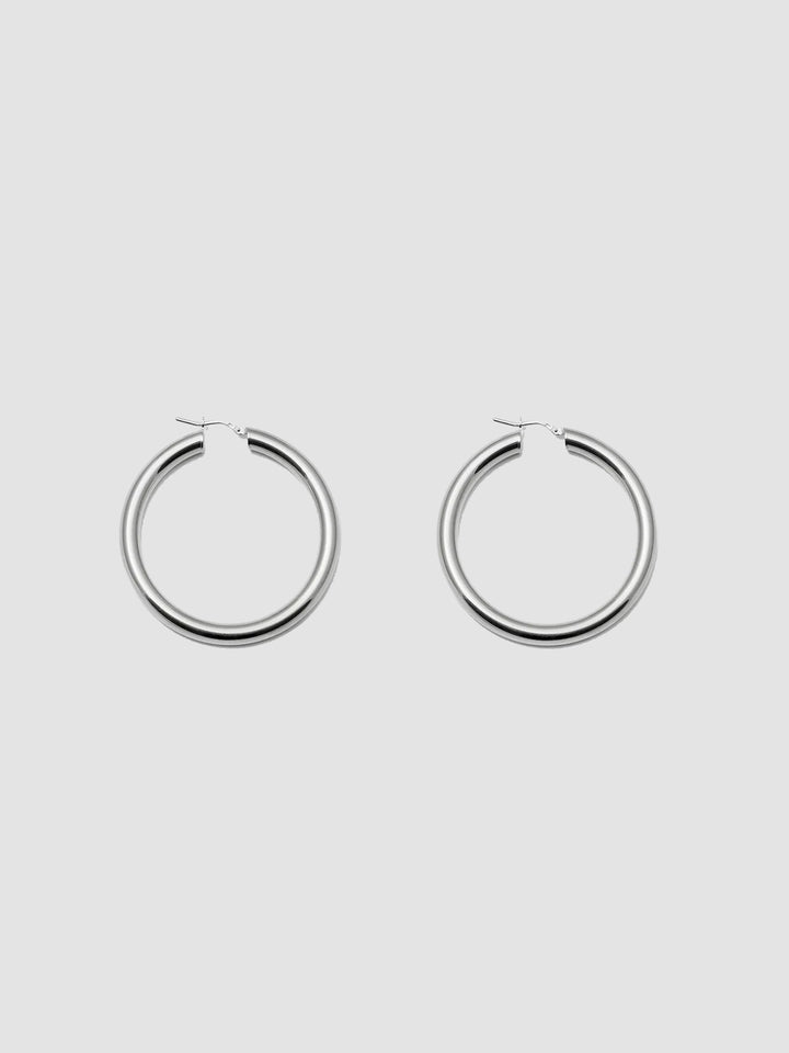 Product shot of the Tru Hoops in Sterling Silver (Sterling Silver Hoops 49.5mm diameter  5mm thick) Background: Grey backdrop