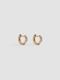 Product shot of the Solo Sparkle Huggies (14kt Yellow Gold 7.7mm Diameter 1.7mm Wide 1.11gr) Background: Grey Backdrop