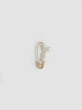 Product shot of the Mini Mixed Pearl Safety Pin Earring (14kt Yellow Gold Mixed Pearl Safety Pin Length: 17mm Mixed Freshwater Pearls) Background: Grey Backdrop